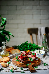 Crostini with steak  with roasted bell pepper. style rustic