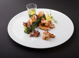 Fried seafood snacks with potato garnish