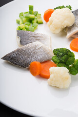 Steamed white fish fillet with vegetables
