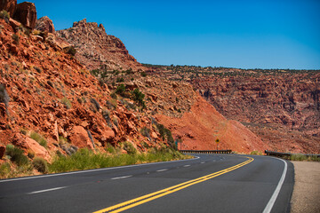 American road trip. Asphalt road and canyon background.