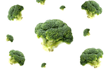 Pieces of broccoli flying on a white background.