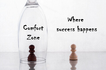 Motivational concept of development and success. On a white background, two chess pawns, black and...