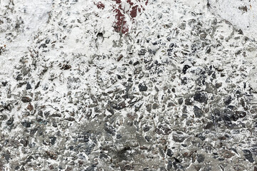 Background concrete wall, traces of weathering, worn wall damaged paint old paint. Remains of old paint on the painted concrete surface. Grungy concrete surface.