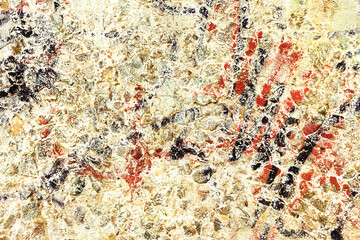 Abstract creative background of chaotic strokes of old cracked paint on concrete wall. Old surface with traces of paint, weathered, scratches and cracks for design