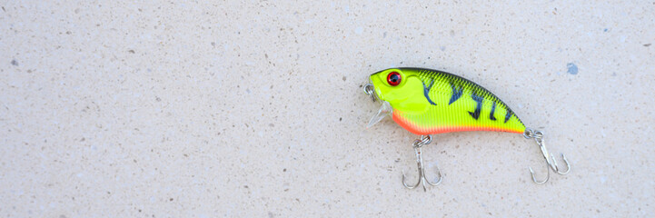 Crete / Greece - Deptember 2019: wobbler yellow green color on the white table background. space for text. banner