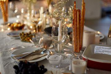 eating, holiday and celebration concept - dinner party table serving at home