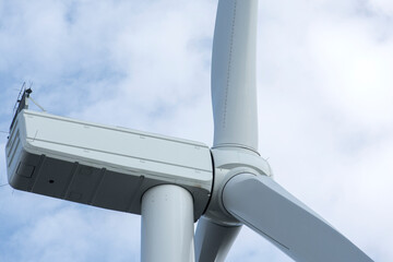 Naklejka na ściany i meble Wind turbine close-up. Alternative energy sources. Electricity industry.