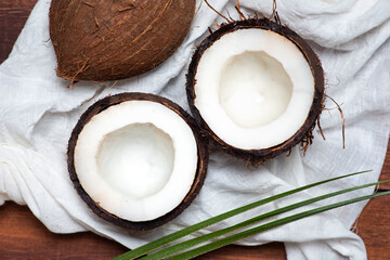 Open coconut on a wooden table top view