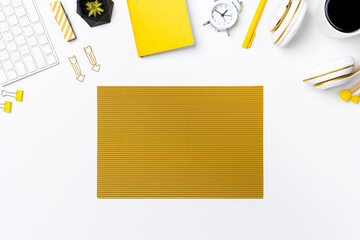 Flay lay of office desk with white background