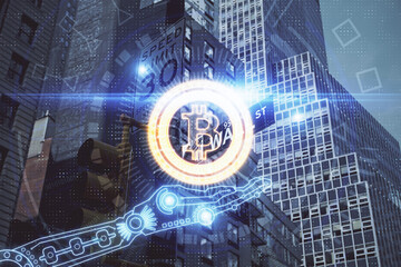Double exposure of crypto currency theme hologram drawing and city veiw background. Concept of...