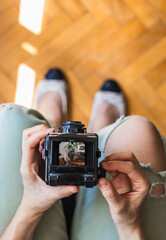 Woman taking photos with her vintage medium format camera.