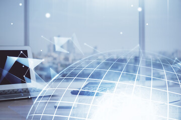 Double exposure of desktop with computer and world map hologram. International data network concept.