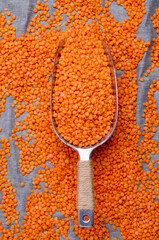 Dry red lentils in a metal scoop
