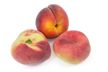 Fototapeta na wymiar Flat peaches and ordinary peach on a white background