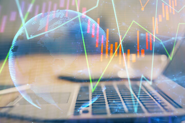 Double exposure of forex chart and work space with computer. Concept of international online trading.