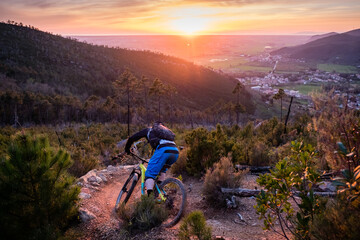 Mountain biker at sunset in Tuscany