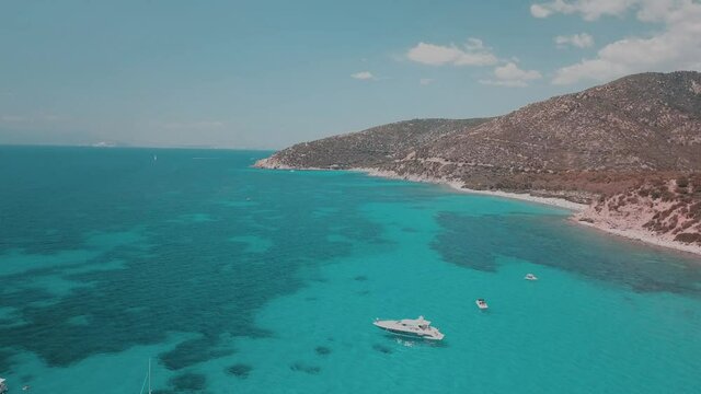 aerial view of sardinia shoreline ( mari pintau ) torquise sea water with clear blue sky in a sunny day during summer season.