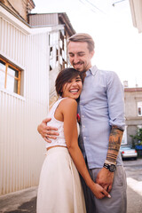 Smiling urban couple at sunset