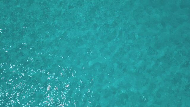 aerial view of sardinia shoreline ( mari pintau ) torquise sea water with clear blue sky in a sunny day during summer season