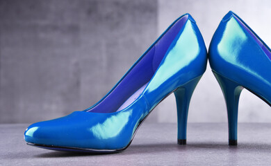 Composition with a pair of blue high heel shoes