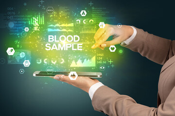 Close-up of a touchscreen with BLOOD SAMPLE inscription, medical concept