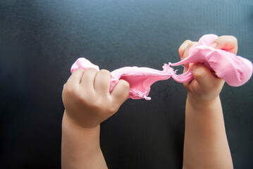 Children's hands are modeling dough for modeling. Children's development and creativity