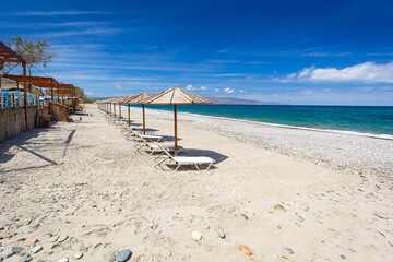 Parasols at the Maleme beach on Crete, Greece