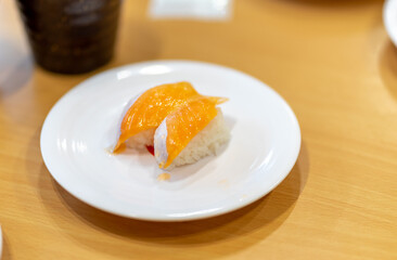 Two Sushi Rolls Served On White Plate