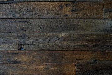 Old brown wooden wall background texture close up