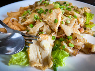 Fried rice noodle with chicken ready to eat on the table