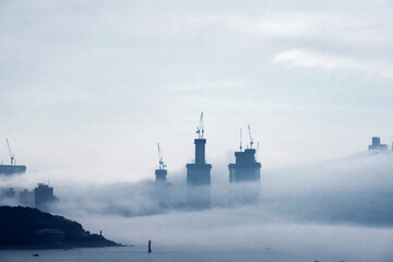 The beautiful beach and bay with thick mist blow from the sea to the land.