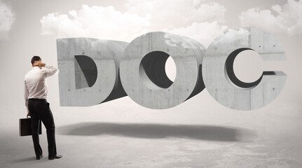 Rear view of a businessman standing in front of DOC abbreviation, modern technology concept