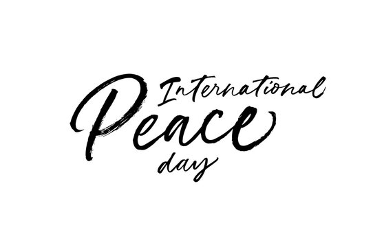 International Peace Day hand written lettering. Hand drawn calligraphy phrase isolated on white background. Lettering of World Peace Day. Holiday calligraphy card, banner, template