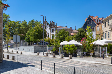 Exterior view of the Church of Nossa Senhora da Conceicao and other classic buildings, coffee shop promenade