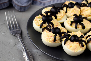 Deviled Eggs With A Spider For Halloween Party.