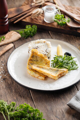 Roasted white fish fillet with rice and arugula