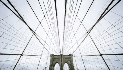 Tourist image of the Brooklyn Bridge without people. Brooklyn Bridge and its wiring forming symmetrical lines.
Brooklyn bridge wallpaper.