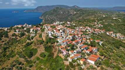 Fototapeta na wymiar Aerial drone photo of uphill breathtaking main town and castle of Alonissos island with views to Aegean sea, Sporades, Greece