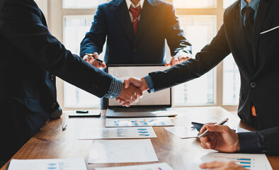 Business people shake hands with business partnership at a meeting. The concept of mediation.