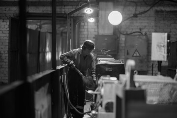 Silhouette of a working miner in a mine