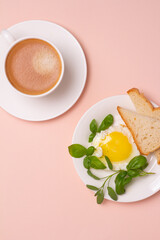 Obraz na płótnie Canvas scrambled eggs with bread and basil and black coffee.