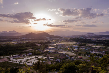 Beautiful landscape panoramic view of county side background curious clouds.