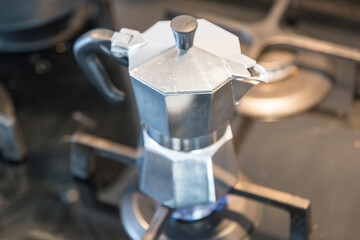 Italian moka coffee machine on fireplace