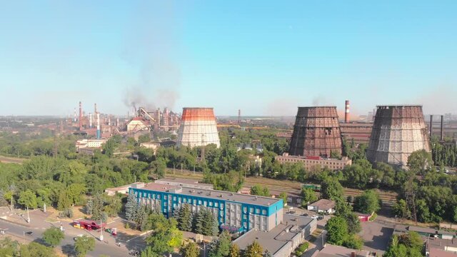 Aerial steel plant manufacturing drone takeoff up camera movement Krivoy Rog Ukraine