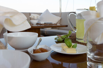 Deck of a classic wooden sailing yacht. Netherlands. Dinner table laid.