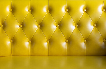 yellow leather sofa texture with buttons for background.