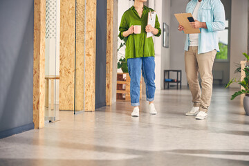 Young female person going to her workplace