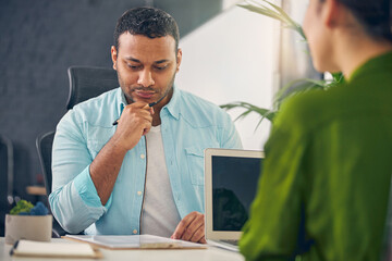 Portrait of serious man who looks at questionnaire