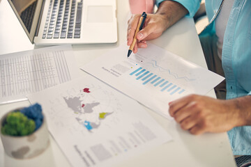 Close up of male hand holding pen