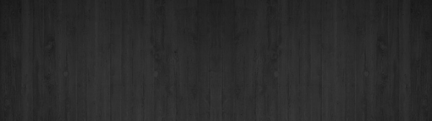 Grunge black anthracite dark concrete wall texture background banner panorama, with wooden boards structure